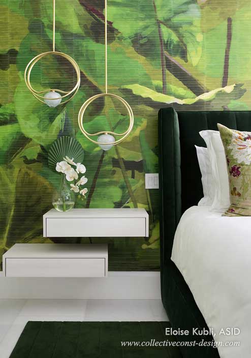 Custom high-end master bedroom detail, white furnishings and bedding, brilliant green pillows, textured verdant rain forest wallpaper, hanging gold light fixtures.