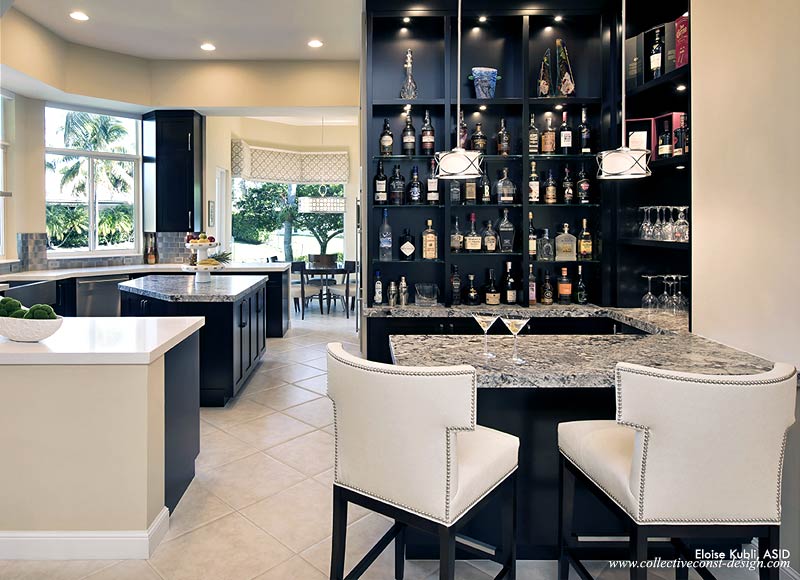 &ldquo;Custom select maple cabinetry is finished with a dye stain. This produces a clear, consistent espresso color that nevertheless reveals the fine natural grain of the wood,&ldquo; explains designer Eloise Kubli. &ldquo;Azul leathered granite at the bar and island contrast with Cesarstone counters elsewhere in the kitchen. An extensive revision to the layout, including the removal of the pantry, created space for a dramatic display in the bar area adjacent to the living room.&rdquo;