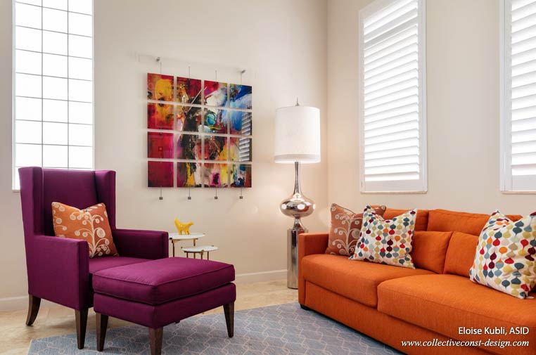 Featuring a large painting on plexiglass suspended from stainless pegs and cable wire, her office is upholstered in purple and orange to bring color in from the foyer.