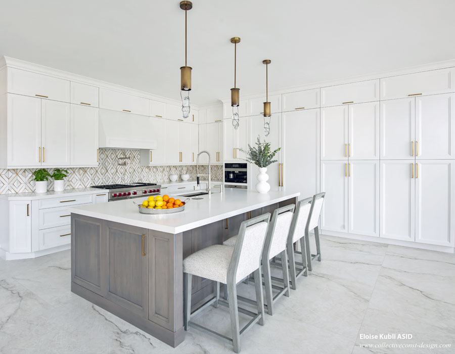 Professionally equipped chef&rsquo;s kitchen with applainces sheathed in panels that blend with the custom millwork and hardware.