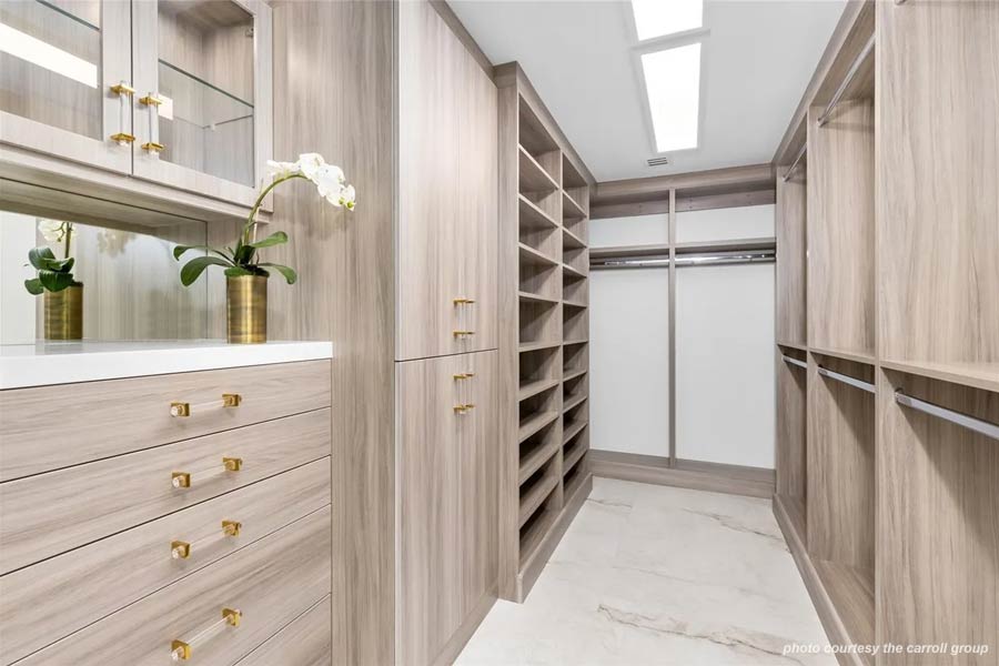 Master Suite Closet featuring custom millwork, Euro laminate construction, and color correct LED lighting.