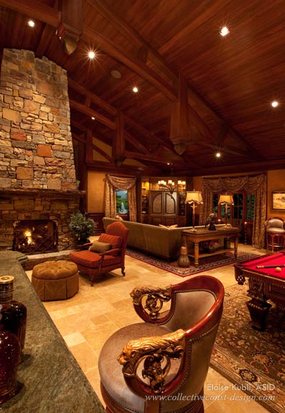 In the game room, a double fieldstone fireplace and Swaim&rsquo;s Old World billiard table combine with E.G. Cody&rsquo;s bronze lionhead carved barstools for a metropolitan masculinity.