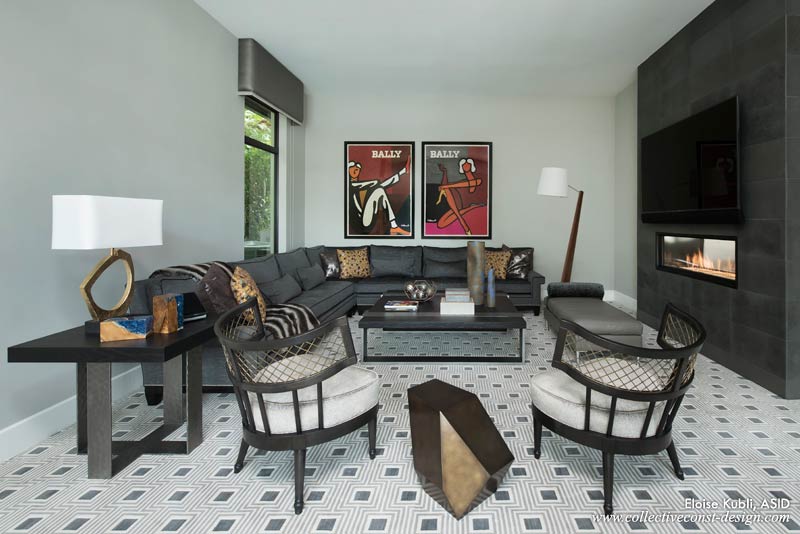 The club room features a linear fireplace that is framed in a dark volcanic stone.