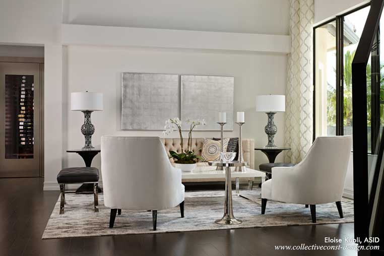 Platinum, silver and polished finishes infuse interest and sophistication in the Living Room.�The custom wine room with a brushed nickel entry door is down the hall.