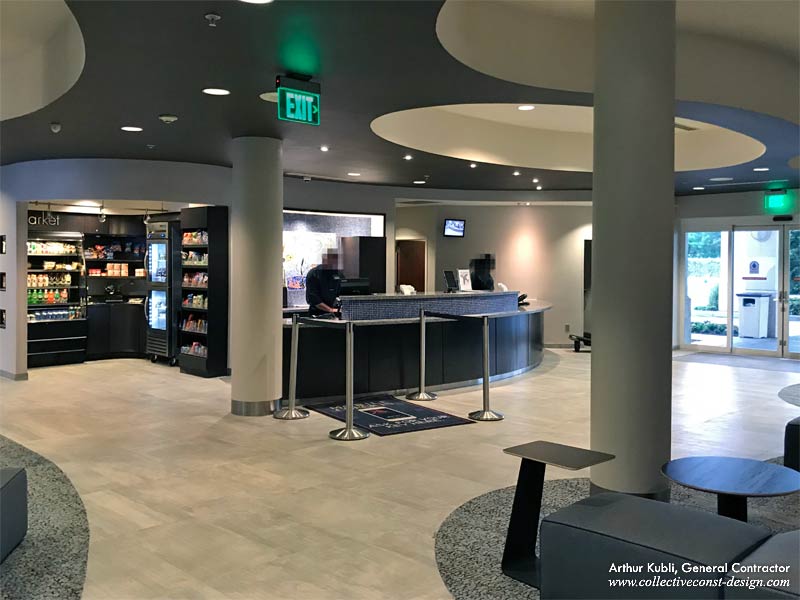 The entire renovation and redesign included ceilings, flooring, quartz countertops, as well as restyling the existing bar and front desk.