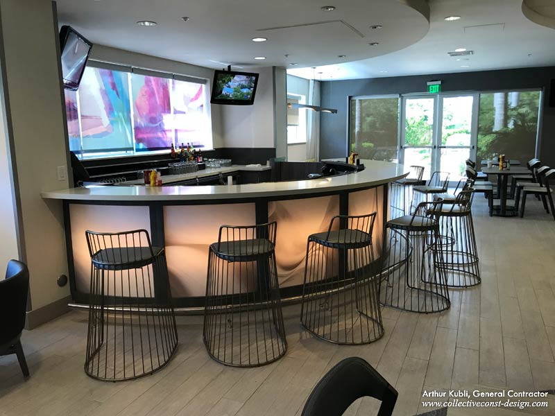 The bar with the new quartz top is totally restyled with a wood grain laminate. 
