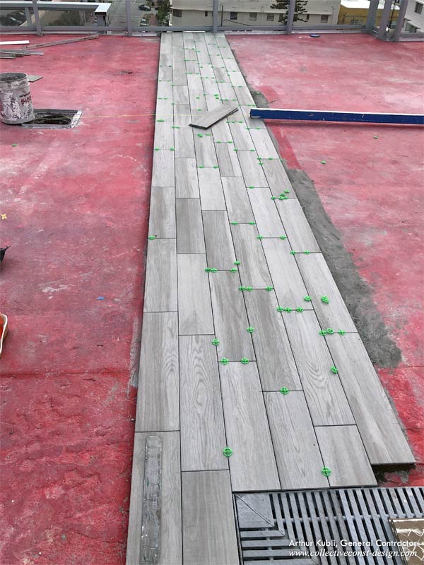 Detail of the rooftop pool deck tile installation.