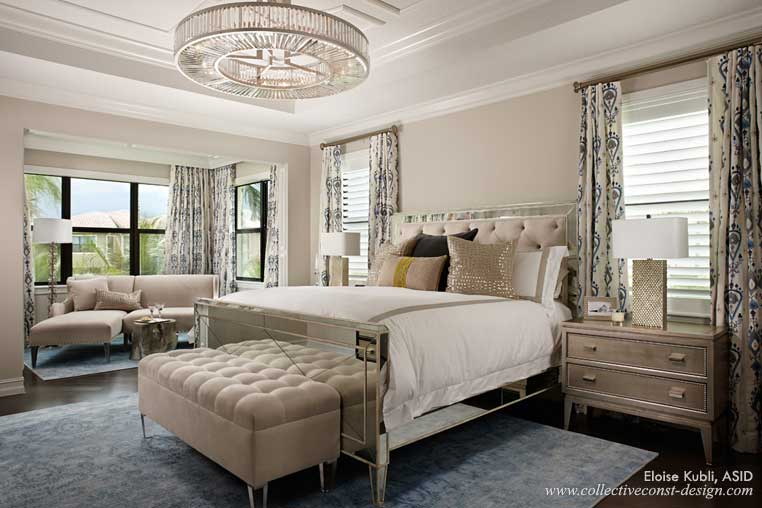 A stunning crystal chandelier and mirrored bed add a spark to the romantic master bedroom.