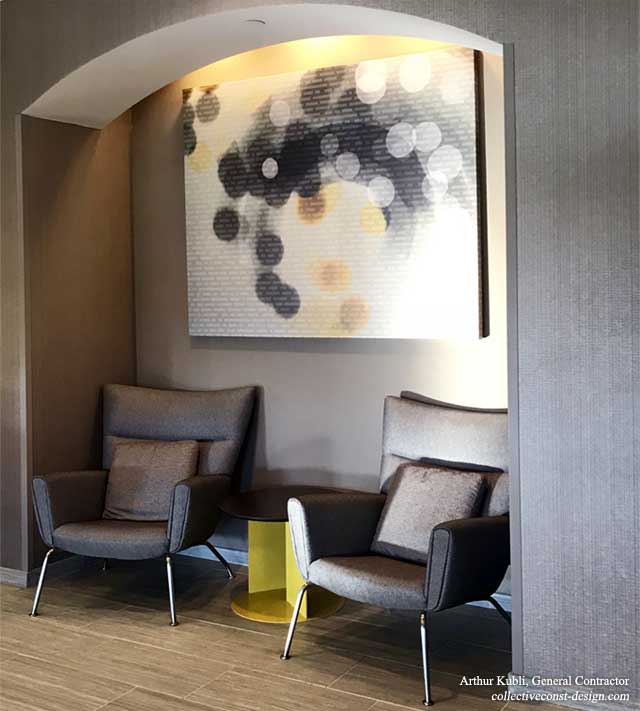 Collective constructed alcove seating in the lobby to allow for private discussions in a public space.