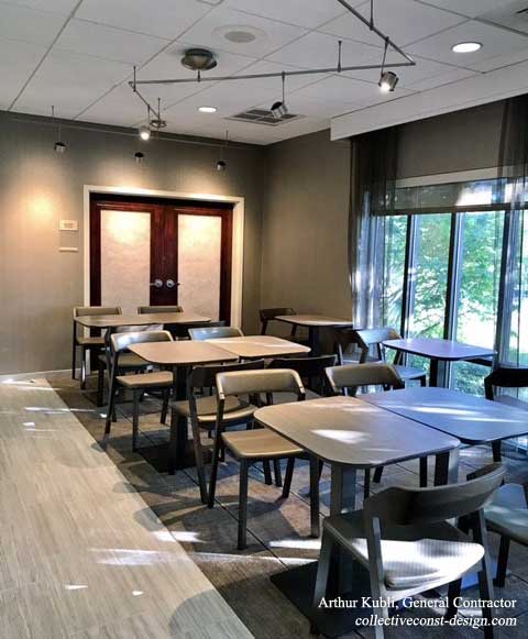 Strategically placed lighting fixtures illuminate specific areas in the cafe.