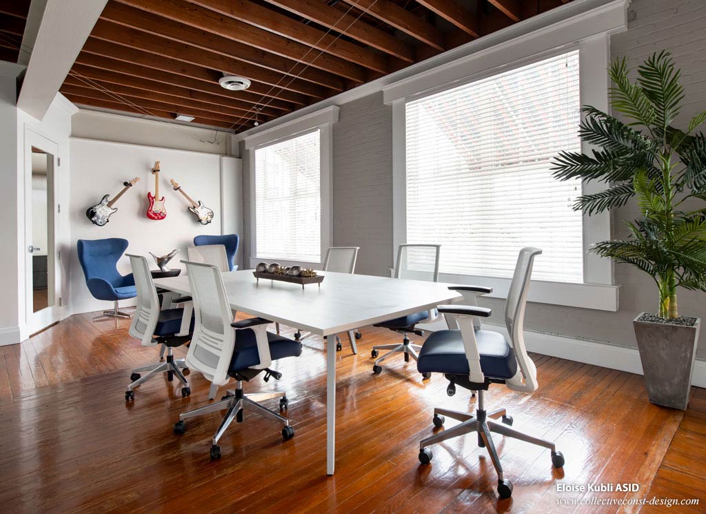 Guitars for jam sssions and a conference table that can serve as a ping pong table are just two of the fresh features in this reimagined workspace.