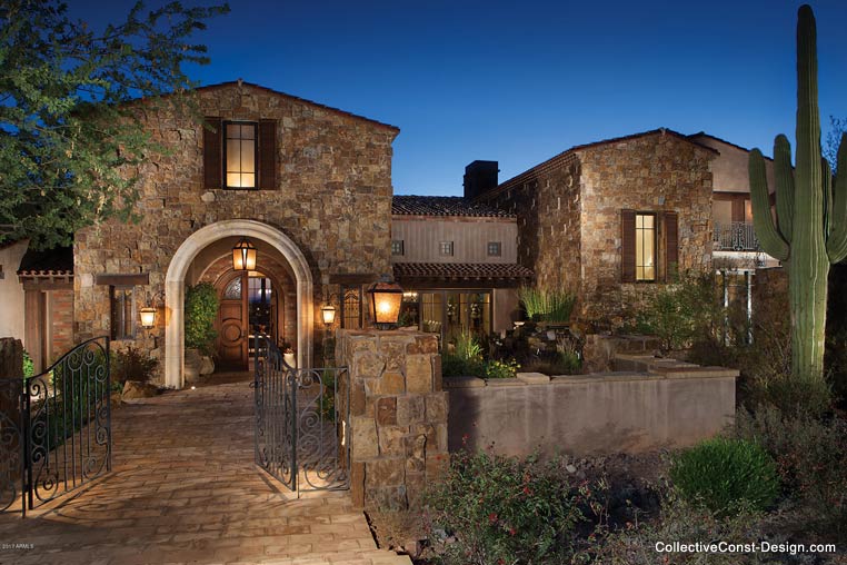 Custom two-story estate, mission style, dusk lighting.