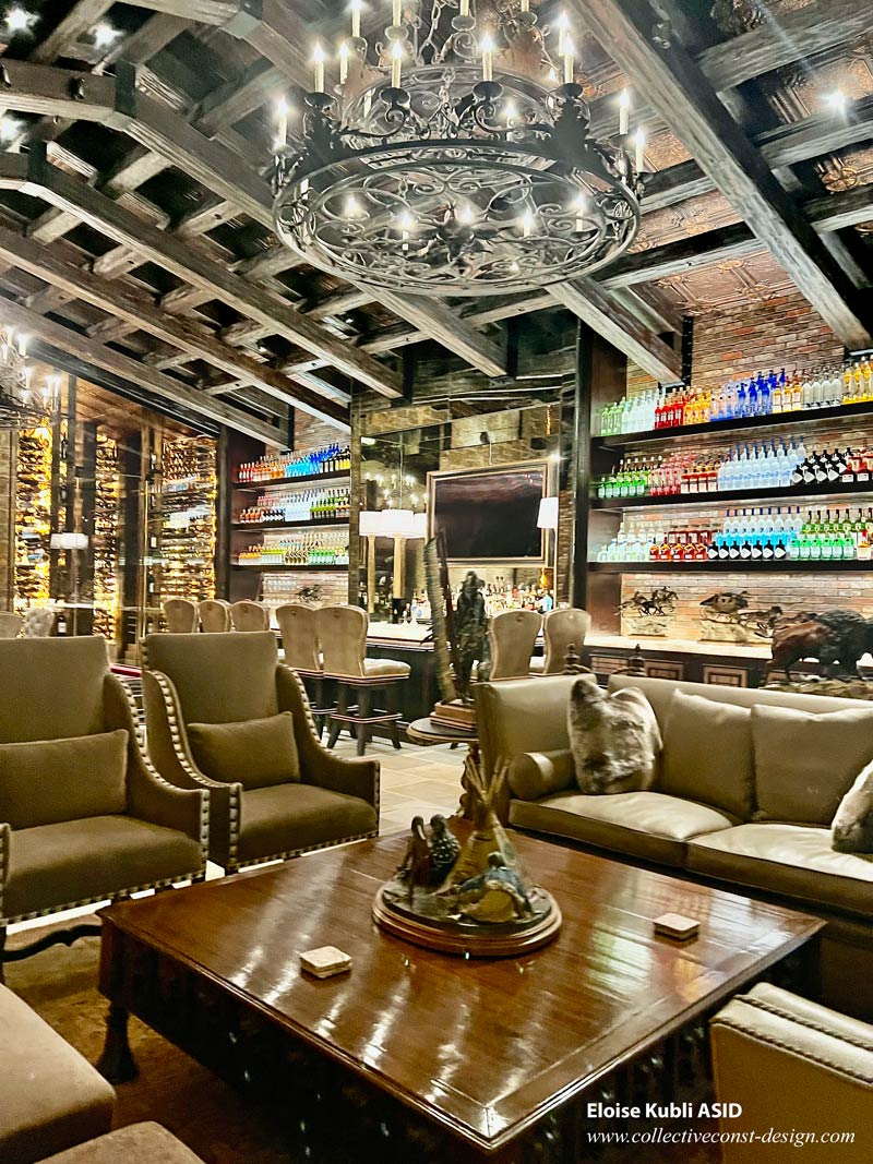 View of bar and wine vault from the great room fireplace seating area.