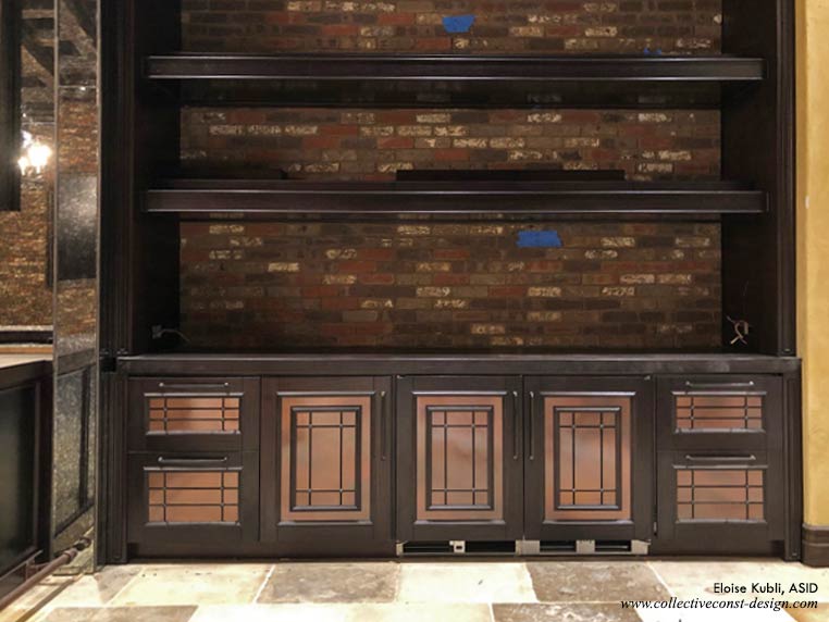 Closer view of dark wood shelves and cabinetry, right side of bar.